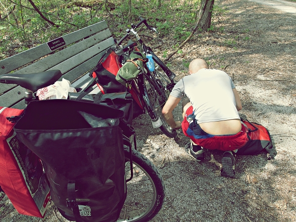 Josh hit his first flat shortly after entering the Katy Trail This would be the first of many.. 